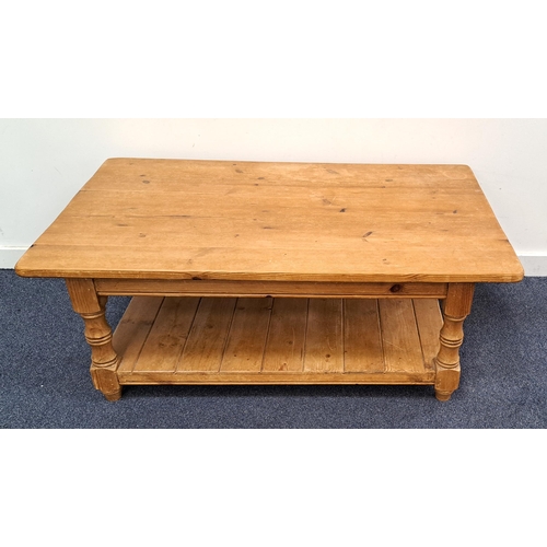 609 - LARGE CONTEMPORARY PINE LOUNGE TABLE
with turned legs and undershelf, 122 x 46 x 75cm