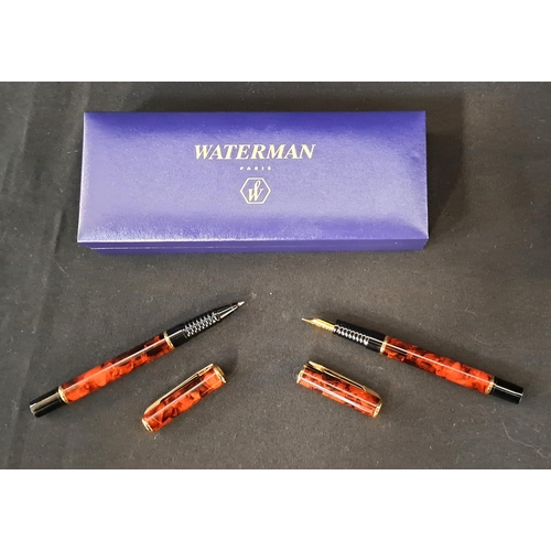 356 - WATERMAN PEN SET
comprising a fountain pen and ball point pen, with red marbled barrels and caps and... 