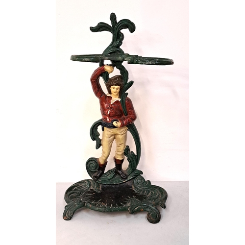 389 - CAST IRON ANTIQUE UMBRELLA STAND 
depicting a man in boots with sash, 56cm high