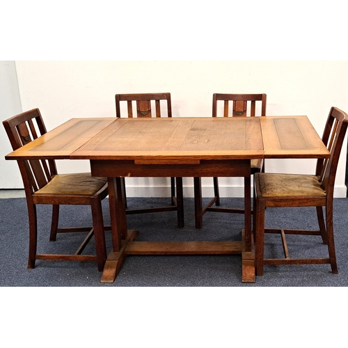 595 - 1930 OAK EXTENDABLE DINING ROOM TABLE WITH FOUR CHAIRS
with green foliate stylised motif details on ... 