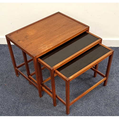 617 - MID CENTURY NEST OF THREE TEAK TABLES
the smaller two examples with black melamine tops, the largest... 