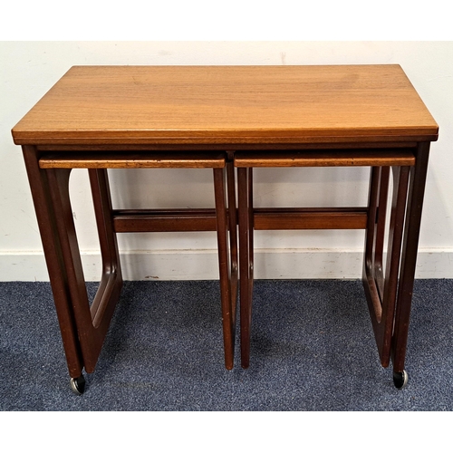 636 - MID CENTURY MACINTOSH TEAK NEST OF TABLES
the larger table with swivel top raised on casters, with t... 