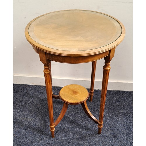 637 - MAHOGANY WINDOW TABLE
the circular top with glass insert, raised on tapering reeded supports united ... 