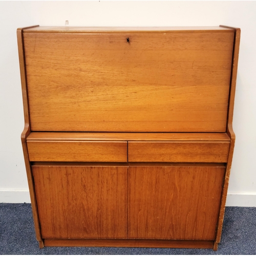 646 - MID CENTURY REMPLOY TEAK BUREAU
the fold out lid with leather insert for writing, with two drawers a... 