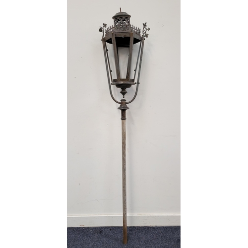 654 - VICTORIAN IRON STREET LANTERN 
on later pole (missing glass from doors), with foliate detail, length... 