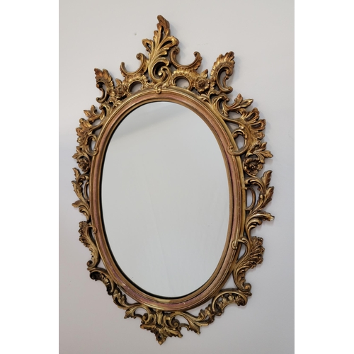 656 - VINTAGE ELABORATE GILT FRAMED OVAL WALL MIRROR
79 x 50cm