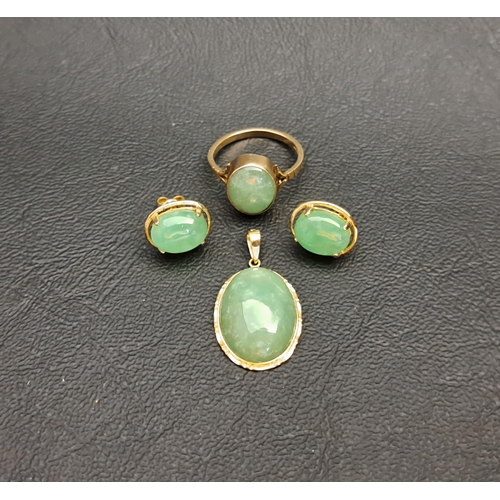 21 - SUITE OF JADE SET JEWELLERY
comprising a ring in nine carat gold and a pair of earrings and pendant ... 