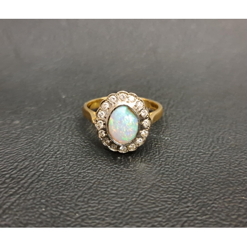 38 - OPAL AND DIAMOND CLUSTER RING
the central bezel set oval cabochon opal in sixteen diamond surround, ... 