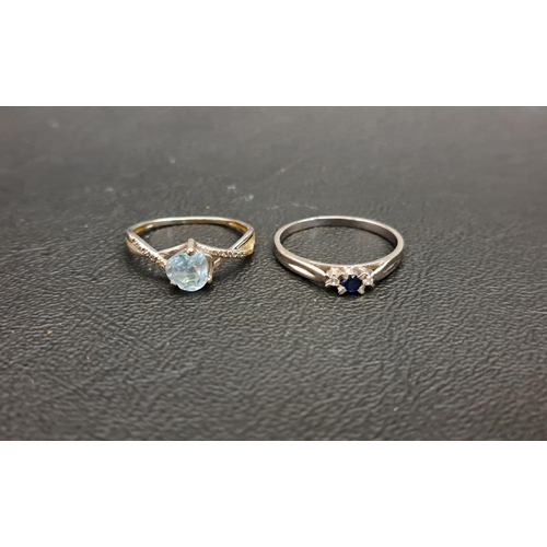 58 - TWO GEM SET RINGS
comprising a sapphire and diamond three stone ring in fourteen carat white gold, r... 