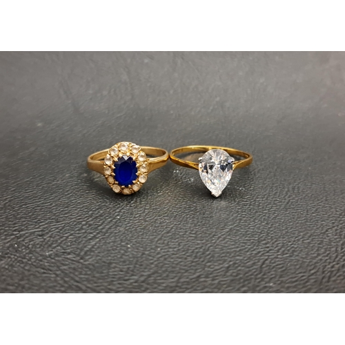 93 - TWO CZ RINGS
one a blue and clear stone set cluster and the other a pear cut solitaire, both in nine... 