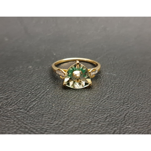 116 - QUASAR CUT QUARTZ DRESS RING BY LEHRER
with central green stone section, with small diamonds to the ... 