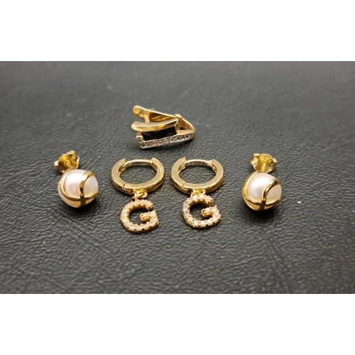 120 - TWO PAIRS OF FOURTEEN CARAT GOLD EARRINGS
one pair of hoops with CZ 'G' drops; and the other a pair ... 