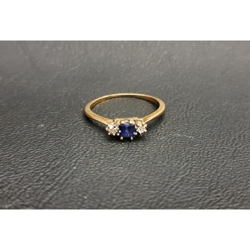 124 - SAPPHIRE AND DIAMOND THREE STONE RING
the central square cut sapphire flanked by small round cut dia... 