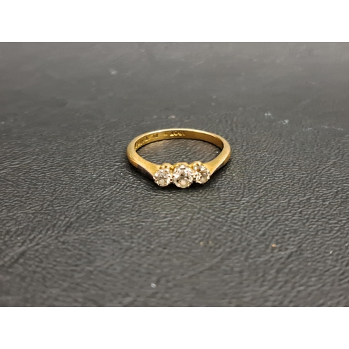 GRADUATED DIAMOND THREE STONE RING
the diamonds totalling approximately 0.3cts, on eighteen carat gold shank with platinum setting, ring size M-N and approximately 2.7 grams