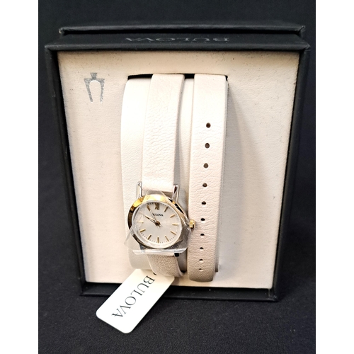 119 - NEW AND BOXED LADIES BULOVA WRISTWATCH
the circular dial with baton five minute markers, on double c... 