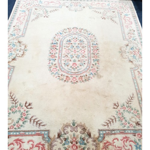 625 - LARGE AUBOSSON STYLE WOOLEN CARPET
on cream ground with floral motifs, 358 x 270cm