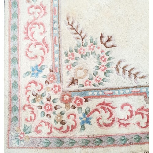 625 - LARGE AUBOSSON STYLE WOOLEN CARPET
on cream ground with floral motifs, 358 x 270cm