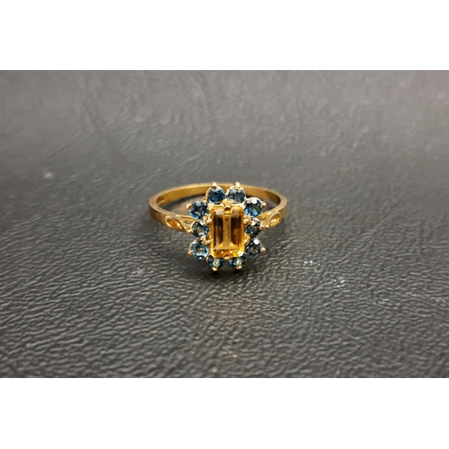 41 - CITRINE AND LONDON BLUE TOPAZ CLUSTER RING
the central emerald cut citrine approximately 0.5cts in t... 