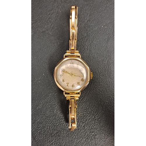 60 - LADIES NINE CARAT GOLD CASED WRISTWATCH
the circular dial with Arabic numerals, the movement marked ... 