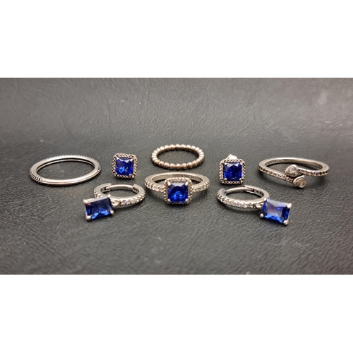 73 - FOUR PANDORA SILVER RINGS AND TWO PAIRS OF EARRINGS
comprising Blue Square Sparkle Halo ring and mat... 