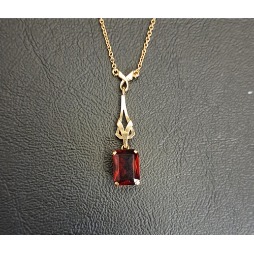 80 - GARNET SET NINE CARAT GOLD PENDANT
the rectangular cur garnet approximately 2.5cts in pierced  nine ... 