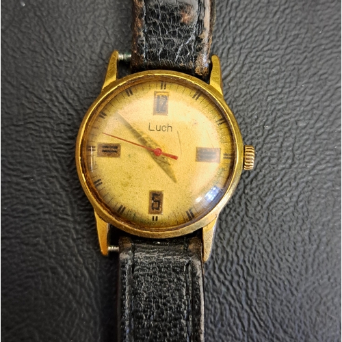 108 - VINTAGE LUCH RUSSIAN WRISTWATCH
the circular dial with markers at 3, 6, 9 and 12, on leather strap