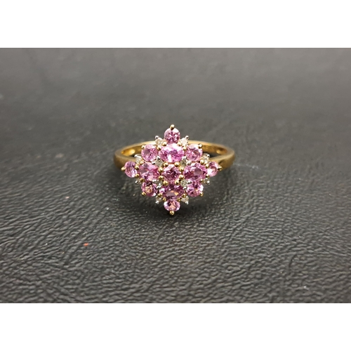 113 - PINK TOPAZ AND DIAMOND CLUSTER DRESS RING
the thirteen round and oval cut pink topaz gemstones separ... 