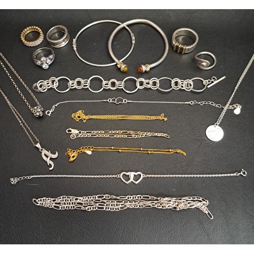 25 - SELECTION OF SILVER JWELLERY
including five rings, a bangle with amber set finials, a multi ring lin... 