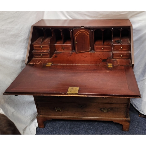 554 - GEORGIAN MAHOGANY BUREAU 
the fall flap revealing fitted interior, the top pigeon holes with hidden ... 