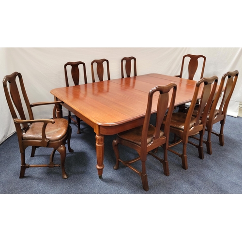 610 - LARGE MAHOGANY EXTENDING DINING ROOM TABLE AND EIGHT CHAIRS
the table raised on turned supports with... 