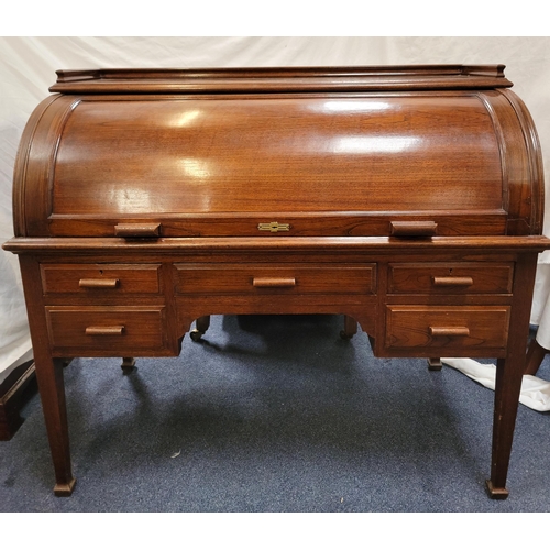 611 - TEAK ROLL TOP CYLINDER DESK
circa 1930s, the revolving cylindrical top opening to reveal a fitted in... 