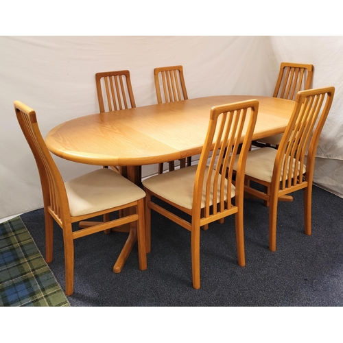 640 - DANISH MID CENTURY OAK EXTENDING PEDESTAL DINING TABLE BY LAURITS M. LARSEN AND SIX CHAIRS
the table... 