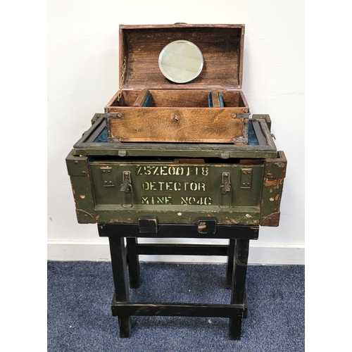 UPCYCLED VINTAGE MILITARY MINE DETECTOR BOX
the box marked 'Z5ZE00 118 Detector Mine No40' now with velvet lined interior and top and with side table support, overall 54.5cm x 71cm x 17.7cm; together with a metal bound wooden chest style jewellery casket with fitted interior and mirror to inner domed cover