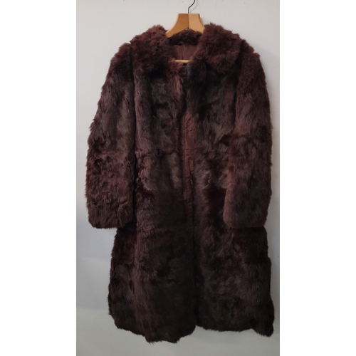 409 - VINTAGE THREE QUARTER LENGTH FUR COAT
of a rich brown colour with collar