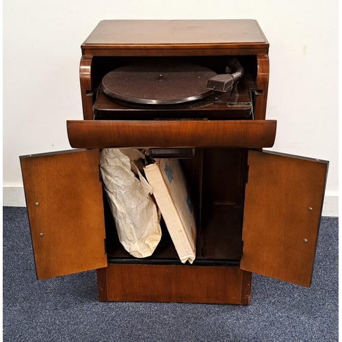 568 - PLUS-A-GRAM RECORD PLAYER
in mahogany veneered cabinet, the fall flap revealing record player above ... 