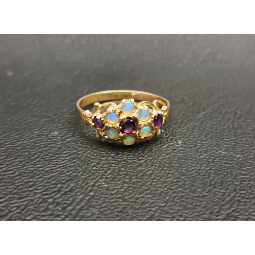 13 - PRETTY OPAL AND AMETHYST CLUSTER RING
on nine carat gold shank with pierced and scroll decorated set... 