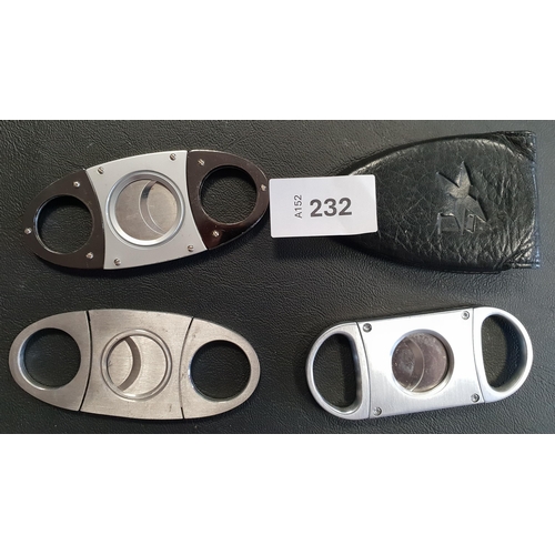 232 - FOUR CIGAR CUTTERS
of various sizes and designs
Note: You must be over the age of 18 to bid on this ... 