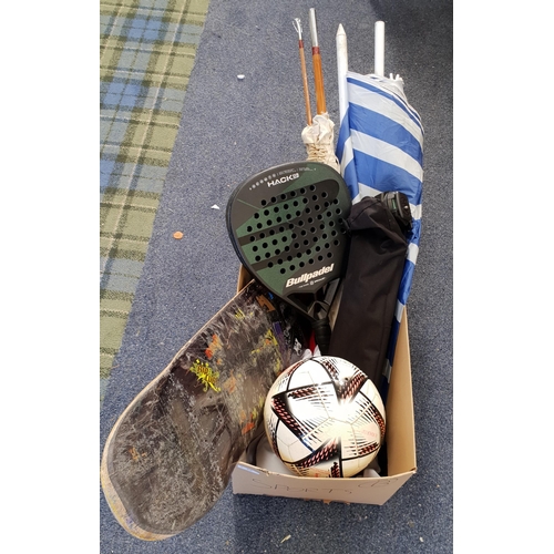 ONE BOX OF SPORTING AND LEISURE ITEMS
including skateboard deck, parasol, fishing rod, tae kwondo clothing, paddle tennis bat, tripod, football etc