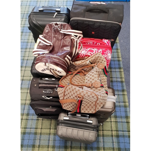 SELECTION OF NINE SUITCASES AND TWO HOLDALLS 
including IT Luggage, Fred Perry, Reebok, Ocean Pacific, Bett, etc.
Note: Suitcases and bags are empty