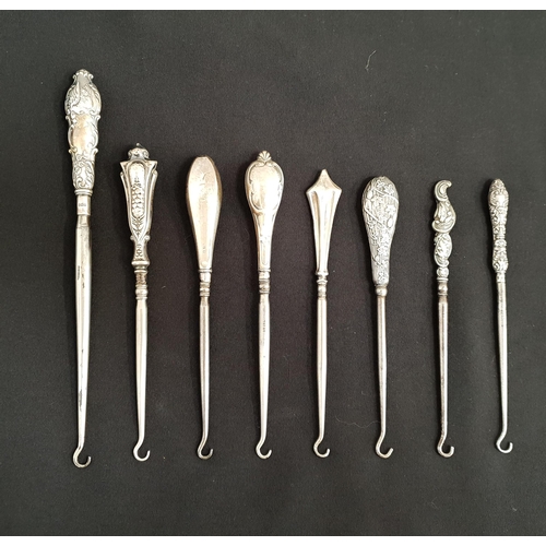 248 - EIGHT SILVER HANDLED BUTTON HOOKS 
all with Birmingham hallmarks, dating from 1861-1914, some with o... 