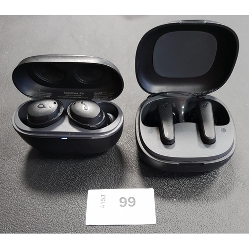 TWO PAIRS OF SOUNDCORE EARBUDS
in charging cases