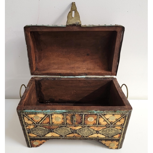 383 - AN INTERESTING DOMED TOP CASKET
with rivets and inlay of brass, bone and coins, the coins stamped wi... 