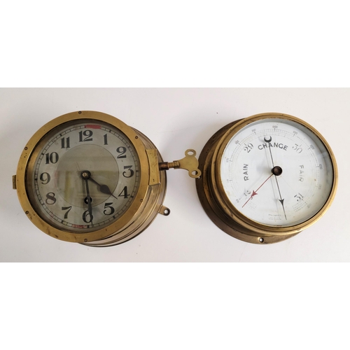 385 - AN INTERESTING BRASS BULKEAD WALL MOUNTED CLOCK
the case in the style of the Kreigsmarine clock, the... 