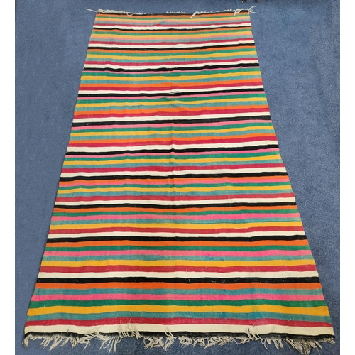 635 - LARGE TURKISH KILIM STYLE RUG
with stripes of various colours and fringing, approximately 188 X 328c... 