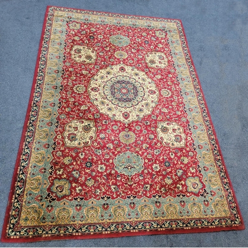 637 - MIDDLE EASTERN STYLE WOOLLEN RUG BY TALAK DESSIN, BELGIUM
with floral design on a red ground, 298 x ... 