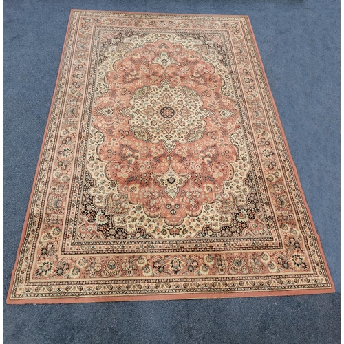 638 - BELGIAN 'TEHRAN' WOOLLEN RUG
on peach ground with cream and navy foliate design, 290 x 200cm