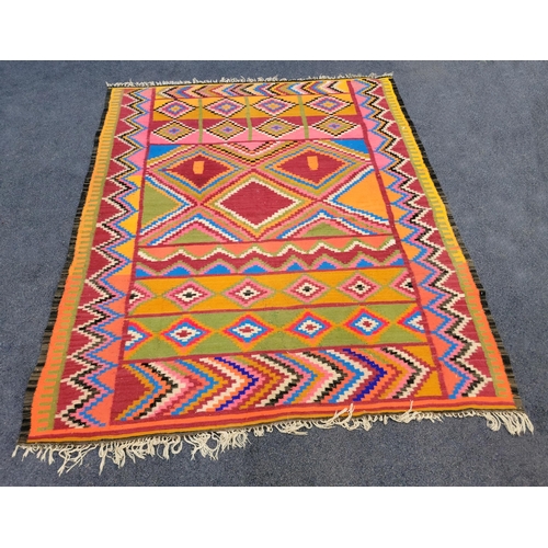 644 - TURKISH WOOLLEN KILIM RUG
of bright bold colours and geometric design with fringing, 206 x 184cm