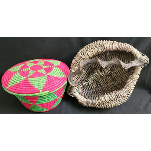 405 - WILLOW BASKET
with twisted oak handle, approximately 50cm wide; together with a colourful handmade w... 