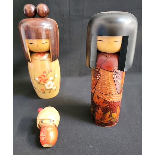 535 - THREE VINTAGE JAPANESE KOKESHI DOLLS
The largest by Kojo signed on the base, 33cm high; another with... 