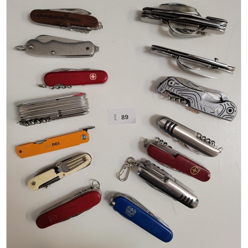 89 - FOURTEEN SWISS ARMY KNIVES AND MULTI-TOOLS
of various sizes and designs
Note: You must be over the a... 